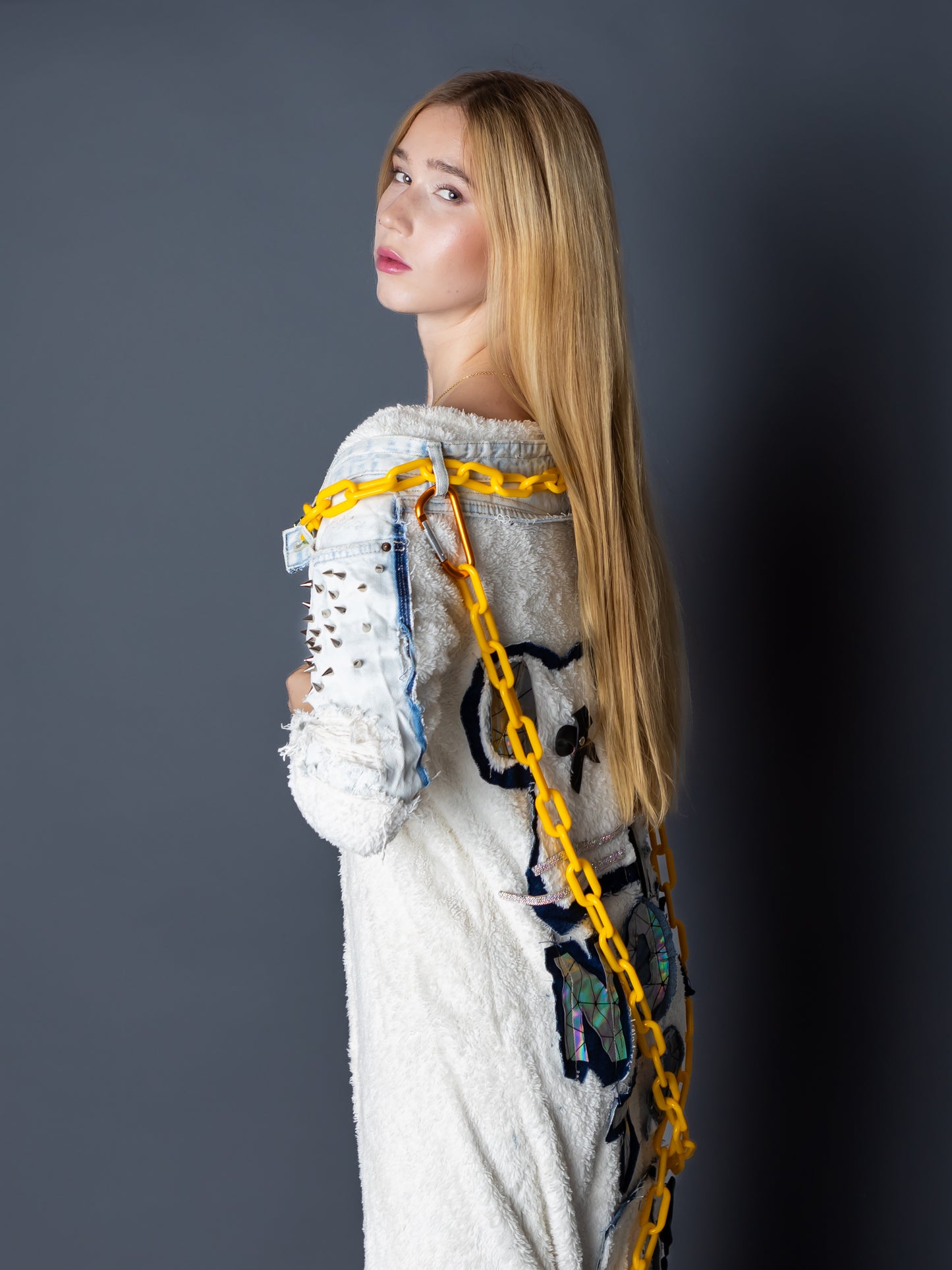 “Not Toy” – Plush White Cardigan with Denim Spikes, Chains & Toy Patch Back